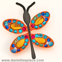 Butterfly craft made with plastic spoons and sequins