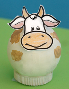 cow made from a wooden ball and bottle cap from www.daniellesplace.com