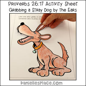 Proverbs 26:17 - Grabbing a stray dog by the Ears Bible lesson about Fighting on Daniellesplace.com